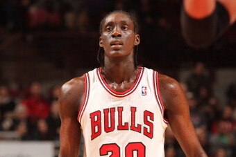 CHICAGO, IL - DECEMBER 07: Tony Snell #20 of the Chicago Bulls looks up court during the game against the Detroit Pistons on December 7, 2013 at the United Center in Chicago, Illinois. NOTE TO USER: User expressly acknowledges and agrees that, by download