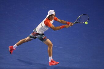 MELBOURNE, AUSTRALIA - JANUARY 16:  Thanasi Kokkinakis of Australia plays a backhand in his second round match against Rafael Nadal of Spain during day four of the 2014 Australian Open at Melbourne Park on January 16, 2014 in Melbourne, Australia.  (Photo