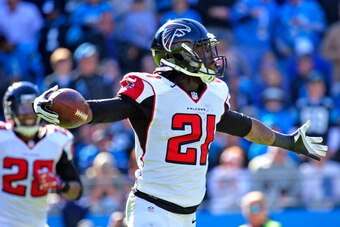 CHARLOTTE, NC - NOVEMBER 03:  Desmond Trufant #21 of the Atlanta Falcons reacts after intercepting a pass from Cam Newton #1 of the Carolina Panthers during play at Bank of America Stadium on November 3, 2013 in Charlotte, North Carolina.  (Photo by Grant