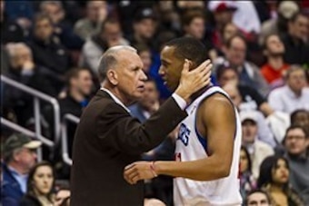 Dec 21, 2012; Philadelphia, PA, USA; Philadelphia 76ers head coach Doug Collins talks with guard Evan Turner (12) during the first quarter against the Atlanta Hawks at the Wells Fargo Center. The Sixers defeated the Hawks 99-80. Mandatory Credit: Howard S