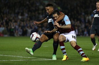 BURNLEY, ENGLAND - SEPTEMBER 24:  Danny Ings of Burnley in action with Jamaal Lascelles of Nottingham Forest during the Capital One Cup Third Round match between Burnley and Nottingham Forest at Turf Moor on September 24, 2013 in Burnley, England.  (Photo