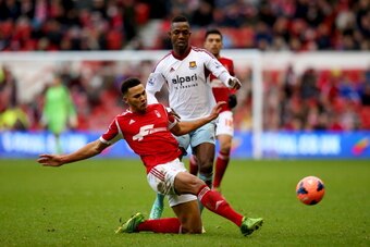 NOTTINGHAM, ENGLAND - JANUARY 05:  Jamaal Lascelles of Nottingham Forest clears the ball from Modibo Maiga of West Ham United during the FA Cup with Budweiser Third round match between Nottingham Forest and West Ham United at City Ground on January 5, 201