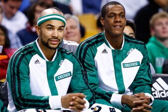 BOSTON, MA - JANUARY 15: Rajon Rondo #9 and Jerryd Bayless #11 of the Boston Celtics sit on the bench in the first quarter against the Toronto Raptors during the game at TD Garden on January 15, 2014 in Boston, Massachusetts. NOTE TO USER: User expressly 