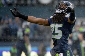 SEATTLE, WA - JANUARY 11:  Cornerback Richard Sherman #25 of the Seattle Seahawks reacts in the second quarter while taking on the New Orleans Saints during the NFC Divisional Playoff Game at CenturyLink Field on January 11, 2014 in Seattle, Washington.  