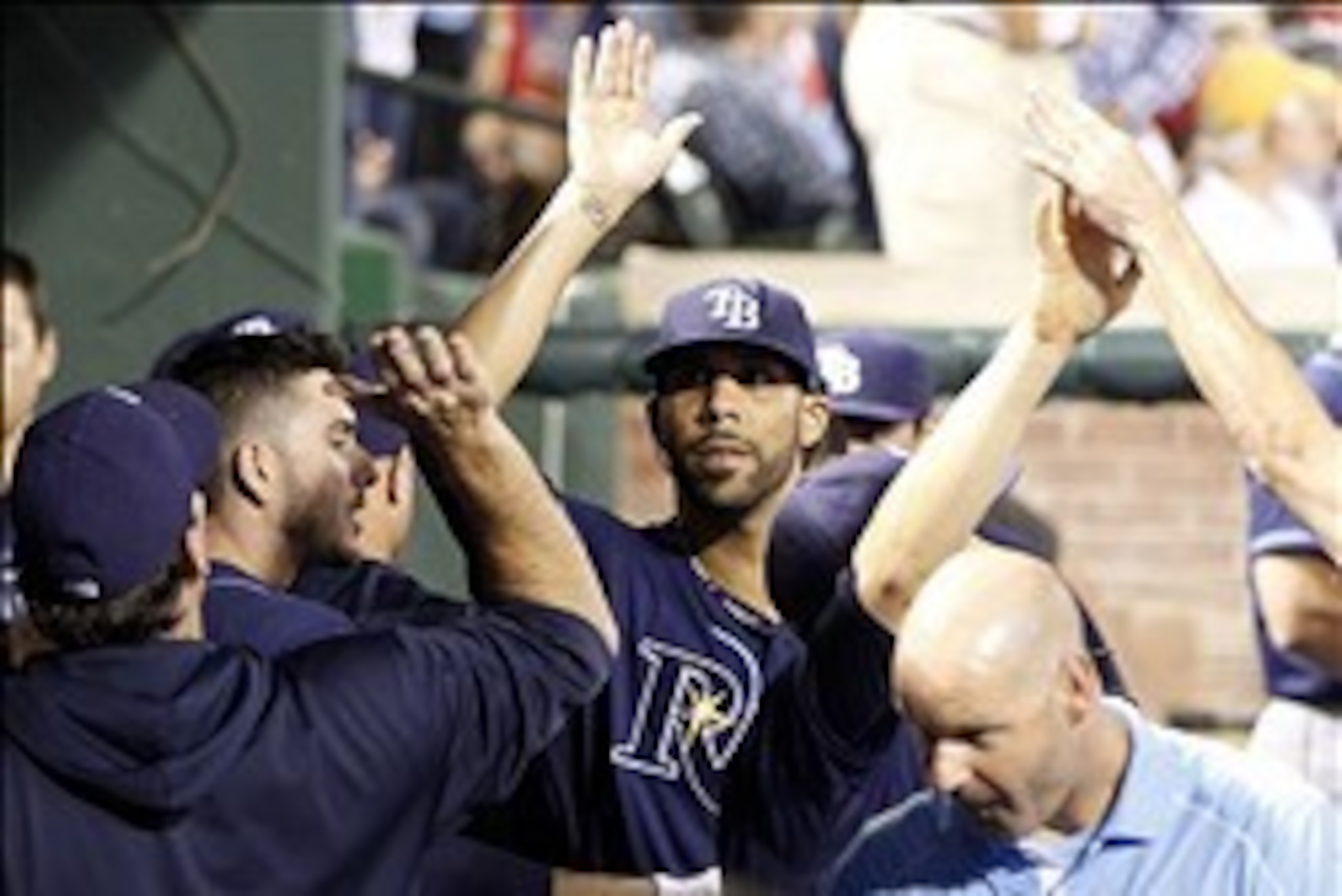 Sep 30, 2013; Arlington, TX, USA; Tampa Bay Rays starting pitcher David Price (middle) is welcomed back to the dugout after retiring the Texas Rangers during the eighth inning at Rangers Ballpark at Arlington. Mandatory Credit: Tim Heitman-USA TODAY Sport