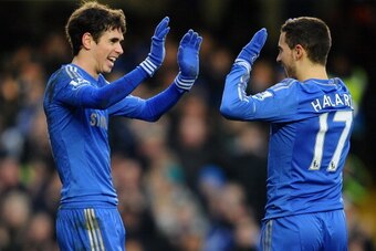 LONDON, ENGLAND - FEBRUARY 09:  Eden Hazard of Chelsea is congratulated on the second goal by Oscar during the Barclays Premier League match between Chelsea and Wigan Athletic at Stamford Bridge on February 9, 2013 in London, England.  (Photo by Laurence 