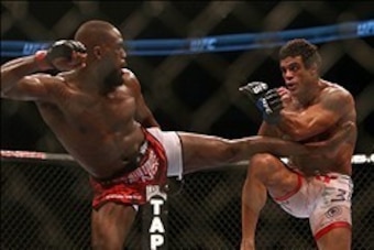 September 22, 2012; Toronto, ON, CANADA; Jon Jones kicks Vitor Belfort in the light heavyweight championship during UFC 152 at the Air Canada Centre. Mandatory Credit: Tom Szczerbowski-USA TODAY Sports