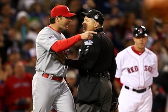 BOSTON, MA - OCTOBER 23:  Manager Mike Matheny #22 of the St. Louis Cardinals argues a call with home plate umpire John Hirschbeck #17 in the first inning during Game One of the 2013 World Series against the Boston Red Sox at Fenway Park on October 23, 20