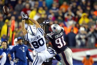 FOXBORO, MA - JANUARY 11:   Coby Fleener #80 of the Indianapolis Colts misses a cathc against  Jamie Collins #91 of the New England Patriots during the AFC Divisional Playoff game at Gillette Stadium on January 11, 2014 in Foxboro, Massachusetts.  (Photo 