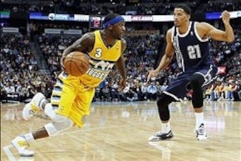 Jan 9, 2014; Denver, CO, USA; Oklahoma City Thunder shooting guard Andre Roberson (21) guards Denver Nuggets point guard Ty Lawson (3) in the fourth quarter at the Pepsi Center. The Nuggets won 101-88. Mandatory Credit: Isaiah J. Downing-USA TODAY Sports
