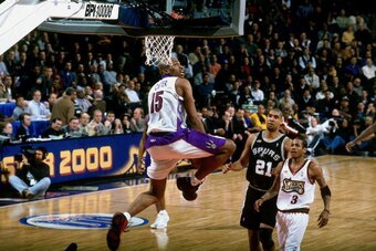 OAKLAND, CA - FEBRUARY 13:  Vince Carter #15 of the Eastern Conference All-Stars elevates for a dunk against Tim Duncan #21 of the Western Conference All-Stars during the 2000 NBA All-Star Game at The Arena in Oakland on February 13, 2000 in Oakland, Cali