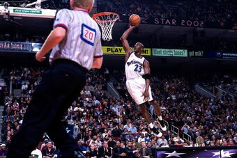 10 Feb. 2002: Michael Jordan #23 of the Washington Wizards goes for a dunk during the 2002 NBA All Star Game at the First Union Center in Philadelphia, Pennsylvania. NOTE TO USER: User expressly acknowledges and agrees that, by downloading and/or using th