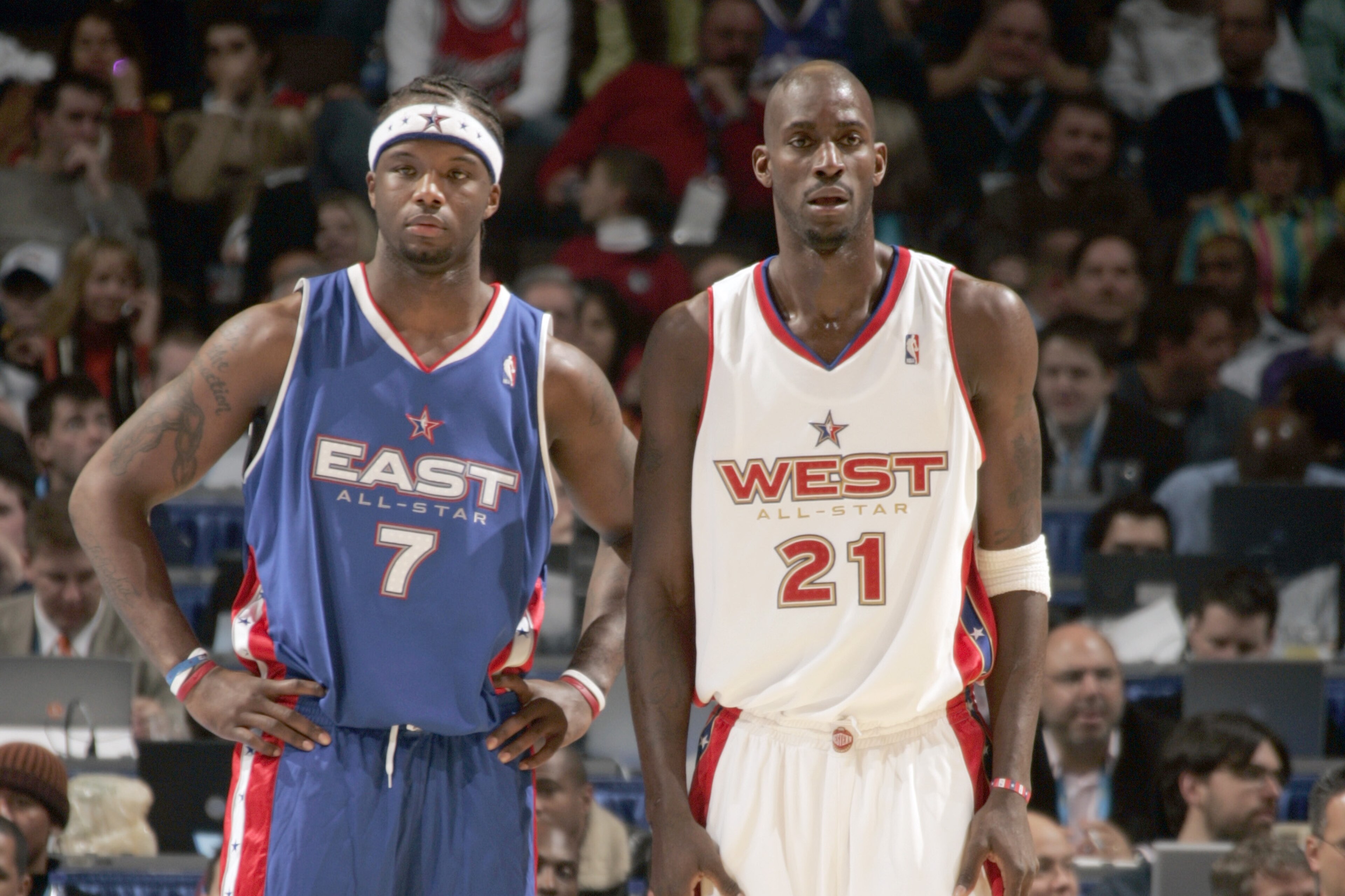 DENVER - FEBRUARY 20:  Jermaine O'Neal #7 of the Eastern Conference All-Stars and Kevin Garnett #21 of the Western Conference All-Stars look on during the 54th All-Star Game, part of 2005 NBA All-Star Weekend at Pepsi Center on February 20, 2005 in Denver