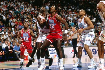 CHARLOTTE, NC - FEBRUARY 10:  Clyde Drexler #22 of the Western Conference All Stars battles for position against Dominique Wilkins #21 of the Eastern Conference All Stars during the 1991 All Star Game played at the Charlotte Coliseum on February 10, 1991