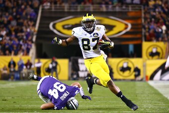 Dec 28, 2013; Tempe, AZ, USA; Michigan Wolverines tight end Devin Funchess (87) runs the ball in the first quarter against the Kansas State Wildcats during the Buffalo Wild Wings Bowl at Sun Devil Stadium. Mandatory Credit: Mark J. Rebilas-USA TODAY Sport