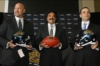 Jan 18, 2013; Jacksonville FL, USA; Jacksonville Jaguars new head coach Gus Bradley (left), owner Shad Khan (middle) and general manager Dave Caldwell pose for photos after a press conference at EverBank Field. Mandatory Credit: Phil Sears-USA TODAY Sport