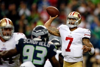 SEATTLE, WA - SEPTEMBER 15:   Colin Kaepernick #7 of the San Francisco 49ers throws a pass against the Seattle Seahawks during their game at Qwest Field on September 15, 2013 in Seattle, Washington.  (Photo by Otto Greule Jr/Getty Images)