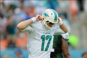 Dec 29, 2013; Miami Gardens, FL, USA; Miami Dolphins quarterback Ryan Tannehill (17) heads back to the sideline during a game against the New York Jets at Sun Life Stadium. Mandatory Credit: Steve Mitchell-USA TODAY Sports