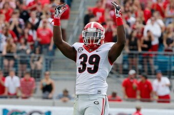 JACKSONVILLE, FL - NOVEMBER 02:  Corey Moore #39 of the Georgia Bulldogs asks the crowd for noise during the game against the Florida Gators at EverBank Field on November 2, 2013 in Jacksonville, Florida.  (Photo by Sam Greenwood/Getty Images)