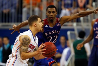 Dec 10, 2013; Gainesville, FL, USA; Kansas Jayhawks guard Andrew Wiggins (22) defends against Florida Gators guard Scottie Wilbekin (5) during the second half at Stephen C. O'Connell Center. Florida Gators defeated the Kansas Jayhawks 67-61. Mandatory Cre