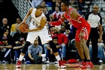 Jan 15, 2014; New Orleans, LA, USA; New Orleans Pelicans power forward Anthony Davis (23) is defended by Houston Rockets power forward Dwight Howard (12) during the second half of a game at the New Orleans Arena. The Rockets defeated the Pelicans 103-100.
