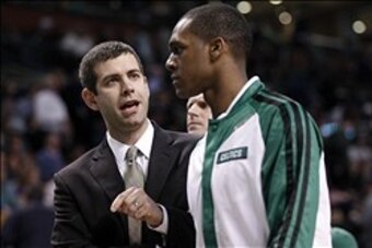 Jan 15, 2014; Boston, MA, USA;  Boston Celtics head coach Brad Stevens talks with point guard Rajon Rondo (9) during the second quarter against the Toronto Raptors at TD Garden. Mandatory Credit: Greg M. Cooper-USA TODAY Sports