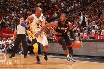 MIAMI, FL - MARCH 10:  Dwyane Wade #3 of the Miami Heat drives against Kobe Bryant #24 of the Los Angeles Lakers on March 10, 2011 at American Airlines Arena in Miami, Florida. NOTE TO USER: User expressly acknowledges and agrees that, by downloading and/