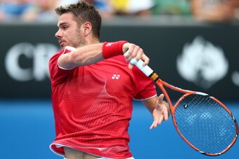 MELBOURNE, AUSTRALIA - JANUARY 15:  Stanislas Wawrinka of Switzerland plays a forehand in his second round match against Alejandro Falla of Colombia during day three of the 2014 Australian Open at Melbourne Park on January 15, 2014 in Melbourne, Australia