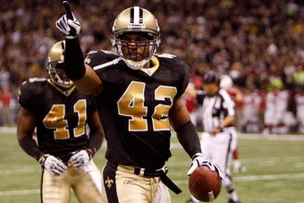 NEW ORLEANS - JANUARY 16:  Darren Sharper #42 of the New Orleans Saints reacts after he broke up a passing play by the Arizona Cardinals during the NFC Divisional Playoff Game at Louisana Superdome on January 16, 2010 in New Orleans, Louisiana. The Saints