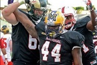 Jan 18, 2014; Carson, CA, USA; LSU fullback J.C. Copeland (44) celebrates with Colorado State outside lineman Jared Biard (69) after he scored a touchdown for the National Team in the first quarter of the NFLPA Collegiate Bowl game at StubHub Center. Mand