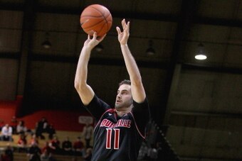 PISCATAWAY, NJ - JANUARY 04:  Luke Hancock #11 of the Louisville Cardinals shoots against the Rutgers Scarlet Knights at Louis Brown Athletic Center on January 4, 2014 in Piscataway, New Jersey.  (Photo by Chris Chambers/Getty Images)