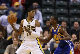 Feb 26 2013; Indianapolis, IN, USA; Indiana Pacers forward Paul George (24) is guarded by Golden State Warriors forward Harrison Barnes (40) at Bankers Life Fieldhouse. Mandatory Credit: Brian Spurlock-USA TODAY Sports