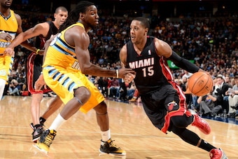 DENVER, CO - DECEMBER 30: Mario Chalmers #15 of the Miami Heat dribbles to the basket against the Denver Nuggets on December 30, 2013 at the Pepsi Center in Denver, Colorado. NOTE TO USER: User expressly acknowledges and agrees that, by downloading and/or