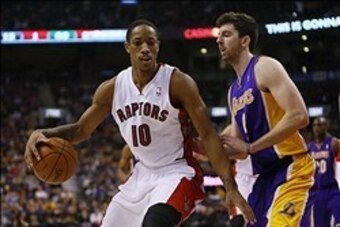 Jan 19, 2014; Toronto, Ontario, CAN; Toronto Raptors guard DeMar DeRozan (10) controls the ball against Los Angeles Lakers forward Ryan Kelly (4) during the first half at the Air Canada Centre. Mandatory Credit: John E. Sokolowski-USA TODAY Sports
