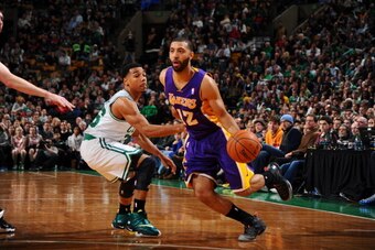 BOSTON, MA - JANUARY 17: Kendall Marshall #12 of the Los Angeles Lakers dribbles to the basket against the Boston Celtics on January 17, 2014 at the TD Garden in Boston, Massachusetts.  NOTE TO USER: User expressly acknowledges and agrees that, by downloa