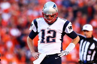 DENVER, CO - JANUARY 19:  Tom Brady #12 of the New England Patriots reacts in the fourth quarter against the Denver Broncos during the AFC Championship game at Sports Authority Field at Mile High on January 19, 2014 in Denver, Colorado.  (Photo by Elsa/Ge