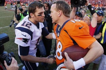 DENVER, CO - JANUARY 19:  Tom Brady #12 of the New England Patriots congratulates  Peyton Manning #18 of the Denver Broncos after the Broncos defeated the Patriots 26 to 16 during the AFC Championship game at Sports Authority Field at Mile High on January