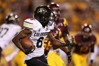 TEMPE, AZ - OCTOBER 12:  Wide receiver Paul Richardson #6 of the Colorado Buffaloes runs with the football after a reception during the college football game against the Arizona State Sun Devils at Sun Devil Stadium on October 12, 2013 in Tempe, Arizona. 