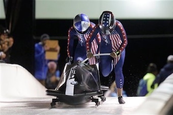 Jones pushing the bobsled.
