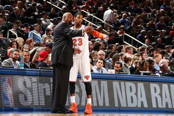 NEW YORK, NY - JANUARY 17: Head Coach Mike Woodson of the New York Knicks instructs player Toure' Murry #23 of the New York Knicks during a game against the Los Angeles Clippers at Madison Square Garden in New York City on January 17, 2014.  NOTE TO USER: