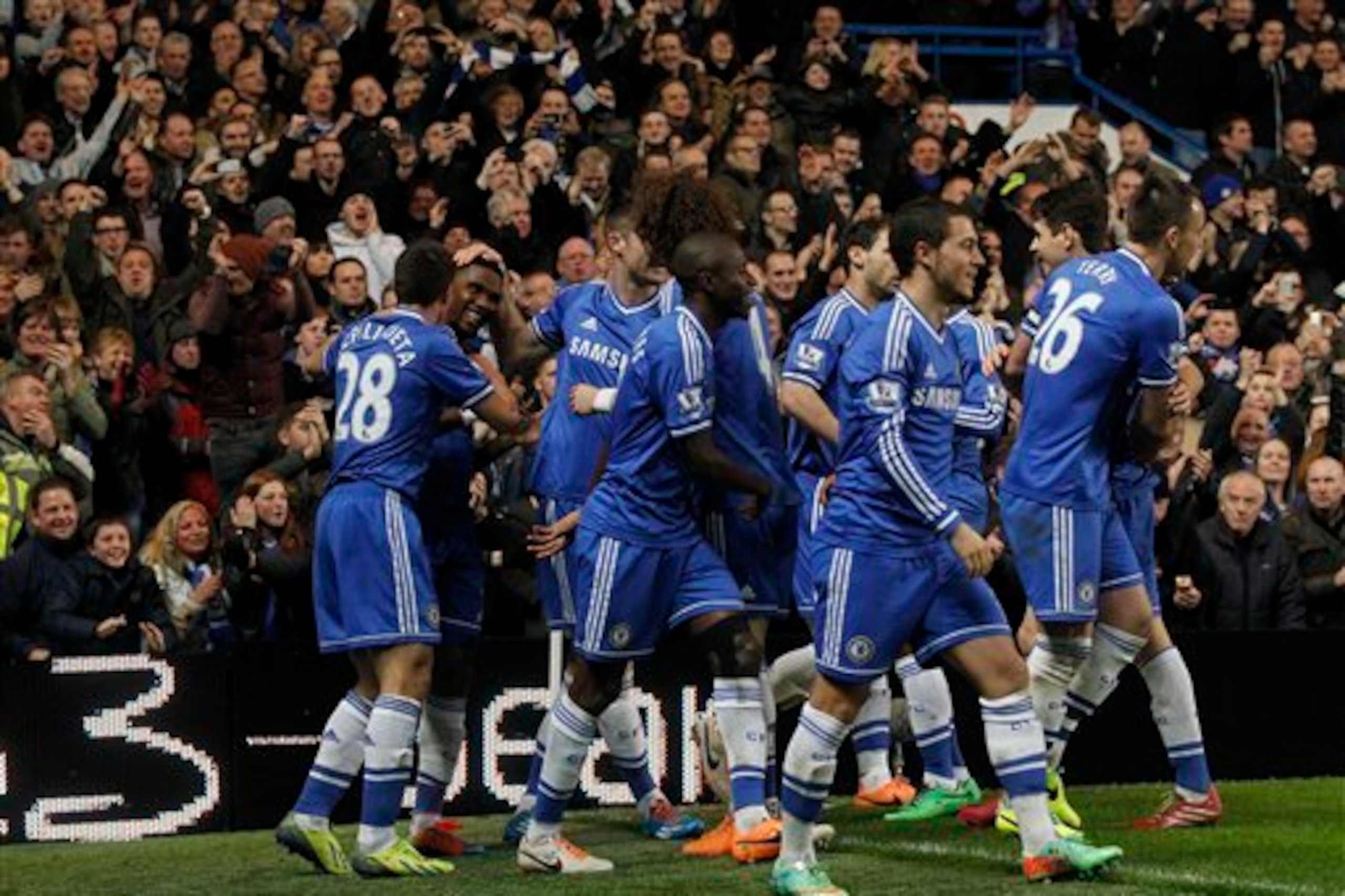 Jubilant Chelsea players celebrate a goal during their win over Manchester United.