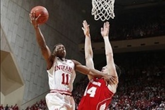 Jan 14, 2014; Bloomington, IN, USA; Indiana Hoosiers guard Yogi Ferrell (11) shoots a basket against Wisconsin Badgers forward Frank Kaminsky (44) at Assembly Hall. Mandatory Credit: Brian Spurlock-USA TODAY Sports Jan 14, 2014; Bloomington, IN, USA; Indiana Hoosiers guard Yogi Ferrell (11) shoots a basket against Wisconsin Badgers forward Frank Kaminsky (44) at Assembly Hall. Mandatory Credit: Brian Spurlock-USA TODAY Sports