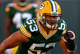 GREEN BAY, WI - AUGUST 09:  Nick Perry #53 of the Green Bay Packers participates in warm-ups before a game against the Arizona Cardinals at Lambeau Field on August 9, 2013 in Green Bay, Wisconsin. The Cardinals defeated the Packers 17-0.  (Photo by Jonath