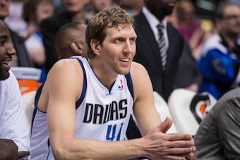 Jan 11, 2014; Dallas, TX, USA; Dallas Mavericks power forward Dirk Nowitzki (41) watches from the bench during the second half against the New Orleans Pelicans at the American Airlines Center. Nowitzki leads team with 40 points. The Mavericks defeated the