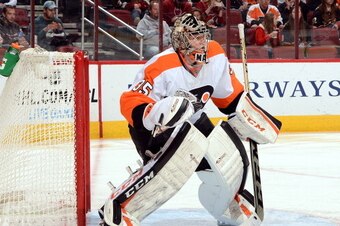 GLENDALE, AZ - JANUARY 04:  Steve Mason #35 of the Philadelphia Flyers gets ready to make a save against the Phoenix Coyotes at Jobing.com Arena on January 4, 2014 in Glendale, Arizona.  (Photo by Norm Hall/NHLI via Getty Images)