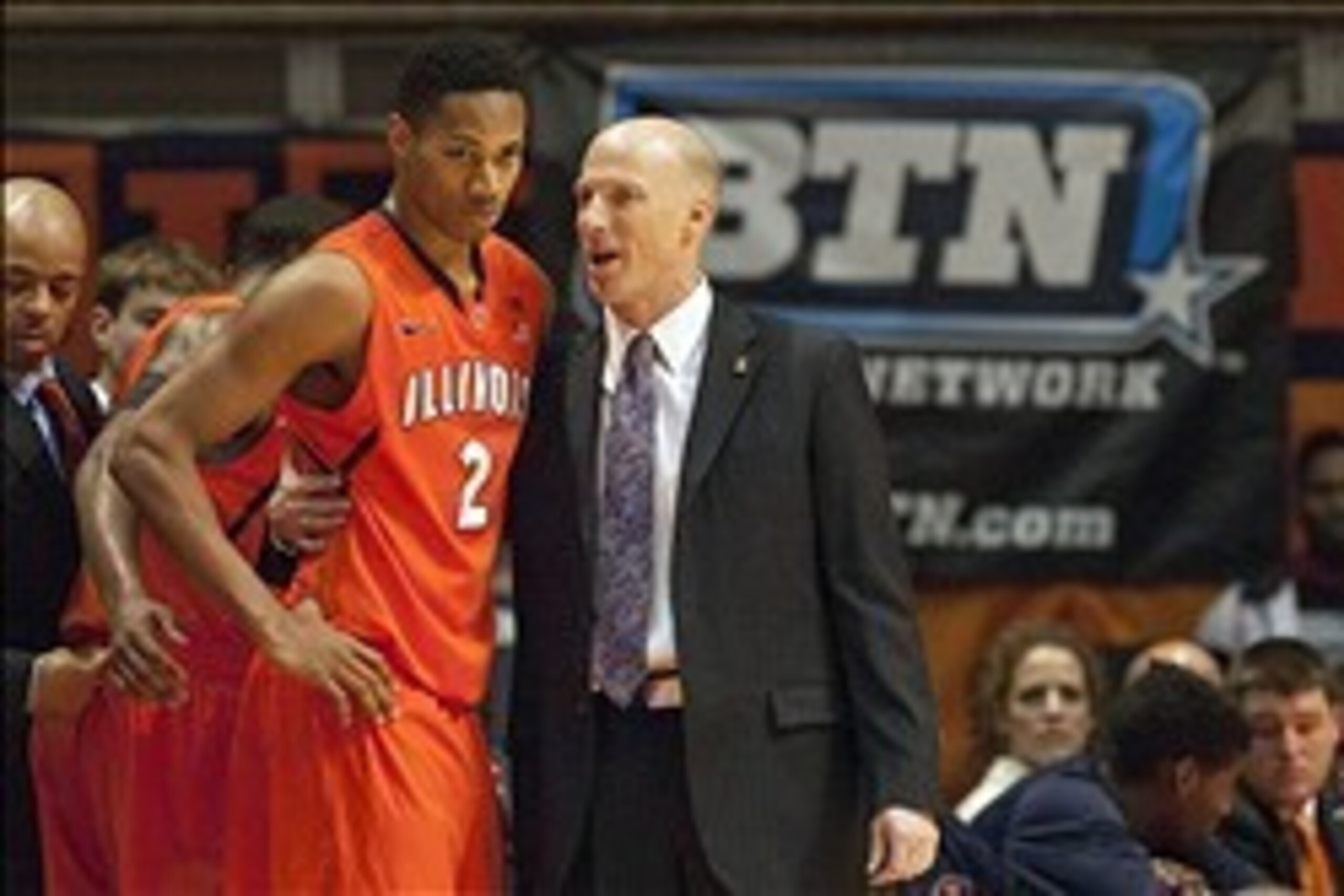 Jan 18, 2014; Champaign, IL, USA; Illinois Fighting Illini head coach John Groce talks with Illinois Fighting Illini guard Joseph Bertrand (2) on the sideline during the second half of the game against the Michigan State Spartans at State Farm Center. The