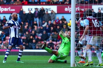 LONDON, ENGLAND - DECEMBER 28:  Nicolas Anelka of West Brom scores their second goal past Jussi Jaaskelainen of West Ham during the Barclays Premier League match between West Ham United and West Bromwich Albion at Boleyn Ground on December 28, 2013 in Lon