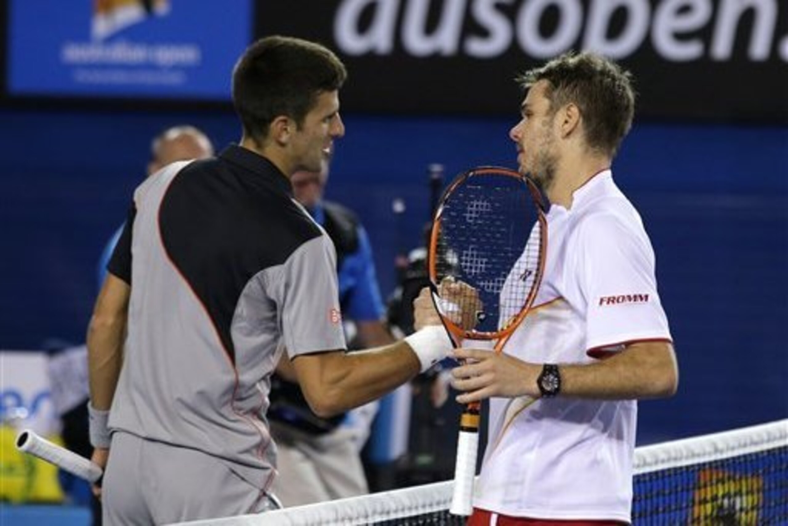 Novak Djokovic congratulates Stanislas Wawrinka on his quarterfinal win. Novak Djokovic congratulates Stanislas Wawrinka on his quarterfinal win.