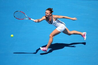 MELBOURNE, AUSTRALIA - JANUARY 20:  Simona Halep of Romania plays a forehand in her fourth round match against Jelena Jankovic of Serbia during day eight of the 2014 Australian Open at Melbourne Park on January 20, 2014 in Melbourne, Australia.  (Photo by