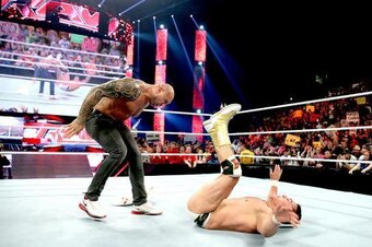 Batista sends Alberto Del Rio crashing to the mat.